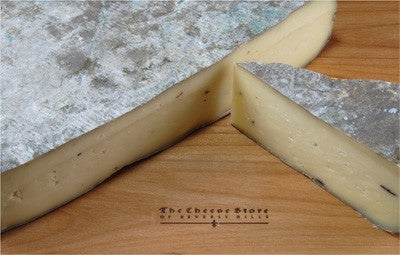 photo of Sottocenere cheese near a basket